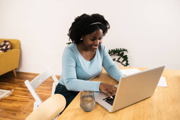 istock Beautiful African American economist working from home 1487640833