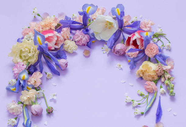 istock beautiful spring flowers on paper background 1487642189
