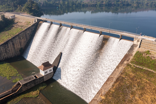 Water flowing from dam aerial landscape view