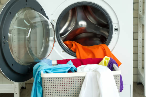 istock Interior of home laundry room with modern washing machine 1487645305