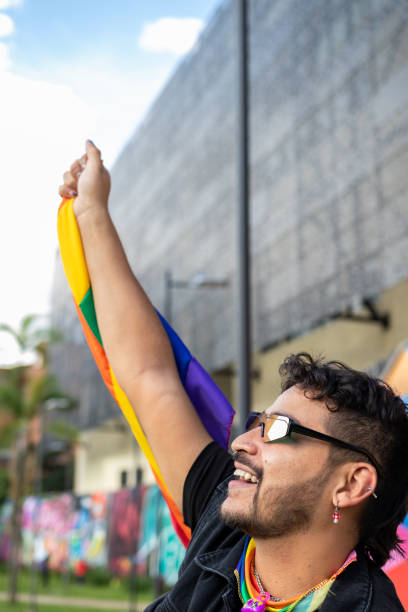 istock Vibrant and Joyful: A Gay Man Beaming with Pride in a Sunny Park 1487649876