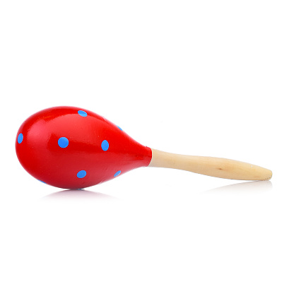 Wooden colored baby rattle isolated on a white background. Bright maracas for a child. Toys for concentration of attention.