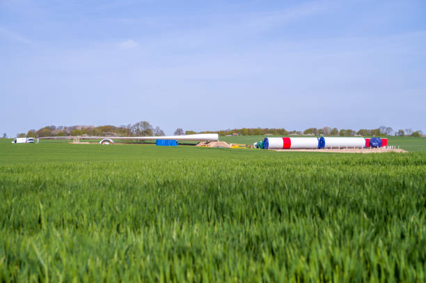 On a field lie the components for a new wind turbine