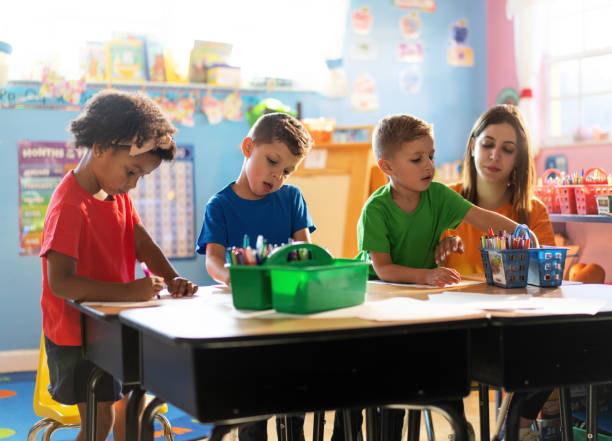 istock Three preschoolers engage in fun and educational activities at their daycare, developing important skills for their future 1487658165
