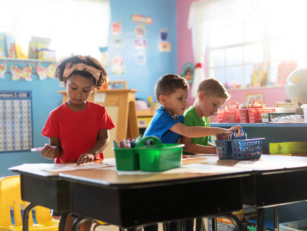 istock Three preschoolers engage in fun and educational activities at their daycare, developing important skills for their future 1487658193