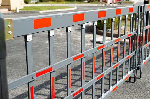 red and white barriers as warning sign
