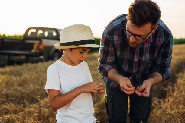 istock father and son on field 1487661536