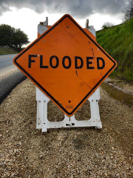 istock Flooded sign on the road 1487664924
