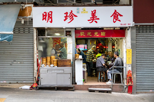 Hong Kong - April 27, 2023 : Customers at a Chinese restaurant in Lok Shan Road, To Kwa Wan, Kowloon, Hong Kong.