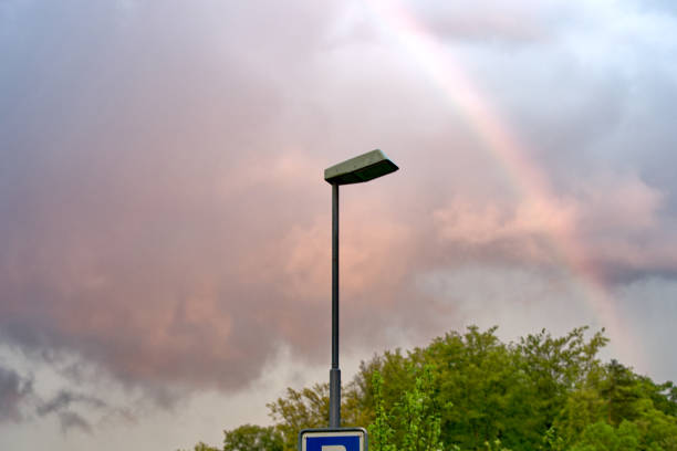 Beautiful rainbow with colorful evening sky at City of Zürich district Schwamendingen on a rainy spring day. Photo taken May 2nd, 2023, Zurich, Switzerland.