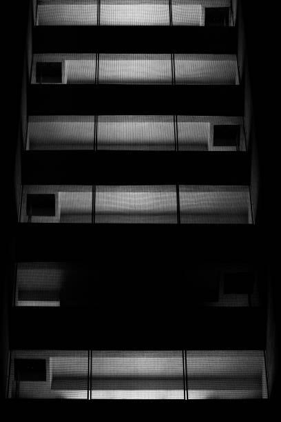 istock Lights in the windows of a skyscraper 1487674746