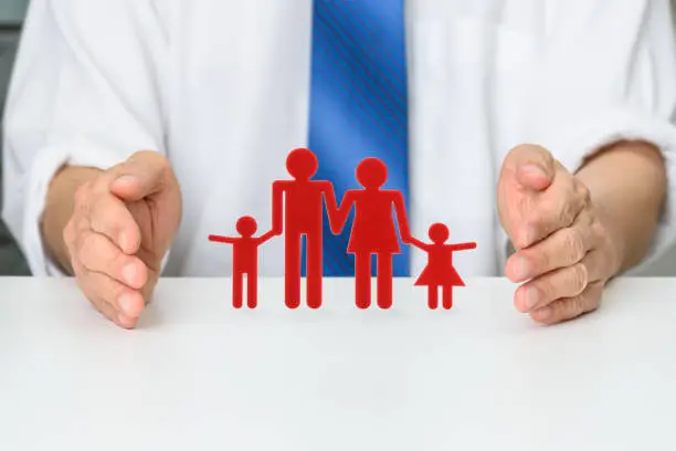 Family life insurance, financial concept : Broker protects family members e.g parents and 2 child, depicting protection from insurer, beneficiary will be compensated by the insurer with insured funds.