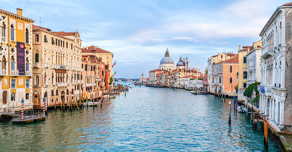 Venice, Italy - November 2022: Cityscape over Grand Canal; View from Academia Bridge overlooking the church of Saint Mary of Health, Santa Maria della Salute