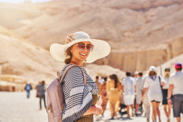 Woman Yourist at Valley of the Kings in Luxor Egypt Woman Yourist at Valley of the Kings in Luxor Egypt. High quality photo temple of luxor hypostyle hall stock pictures, royalty-free photos & images