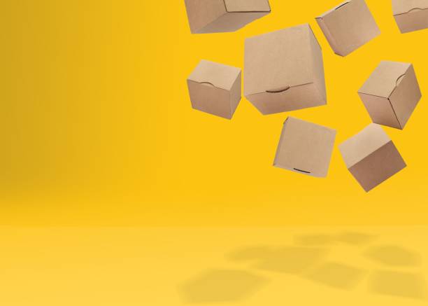 istock 3D rendering of cardboard boxes against a yellow background. Shipping concept. 1487680055