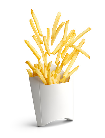 French fries bursting out from white paper box isolated on white