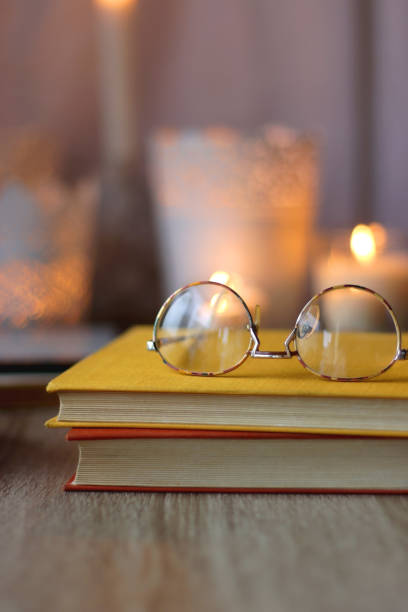 istock Books, Glasses, E-Reader, Pen, Tea, Cookies and Candles 1487680216
