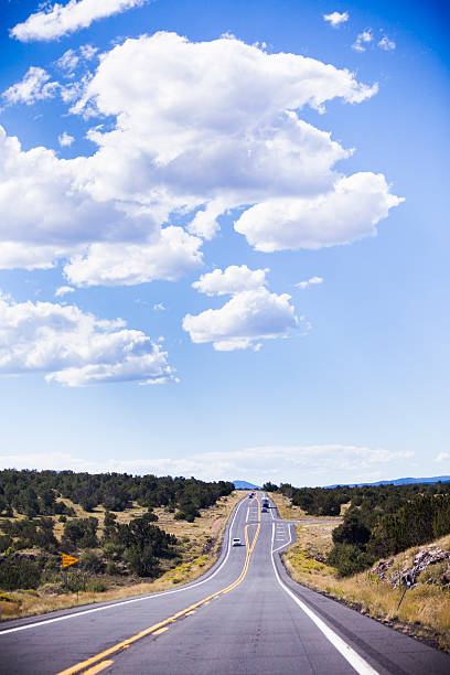 istock Country Road under a vivid blue sky with clouds 148768224
