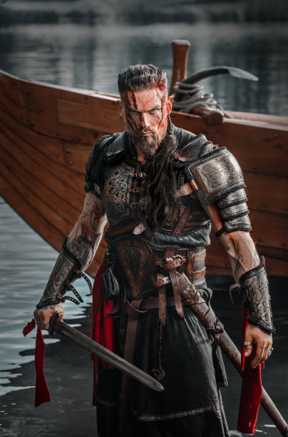 istock Viking Warrior sailing on a fjord on an authentic viking long boat 1487683086