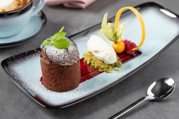 istock Chocolate souffle with ice cream served in a fine dining restaurant 1487686918