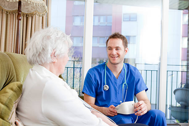 istock Nurse checking senior ladys blood pressure 148768734