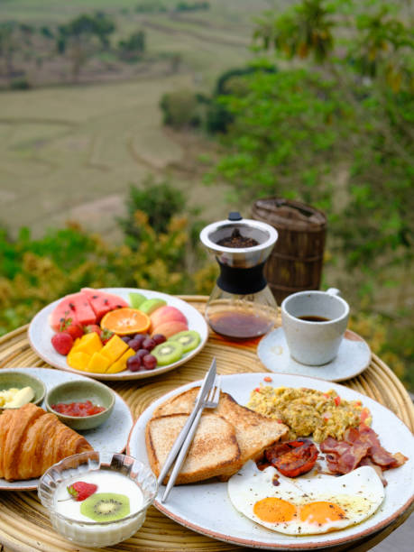 istock American breakfast with eggs, bread,bacon,milk, coffee and orange juice 1487688779