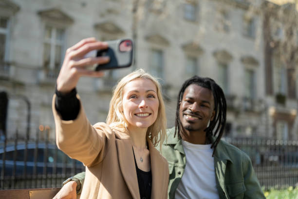istock Couple taking selfie in London square 1487689440