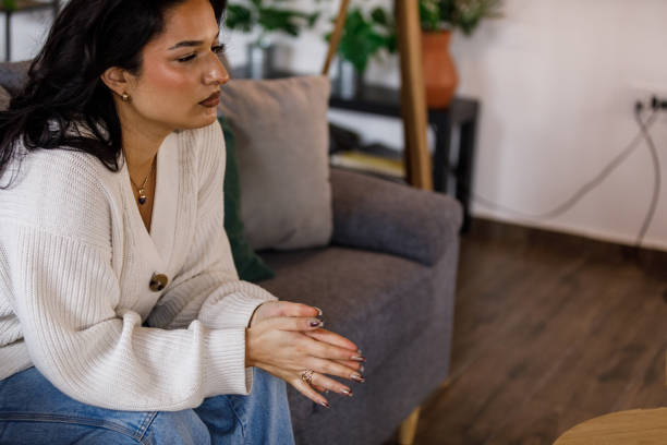 istock Young woman contemplating and anxious fidgeting her hands 1487689763