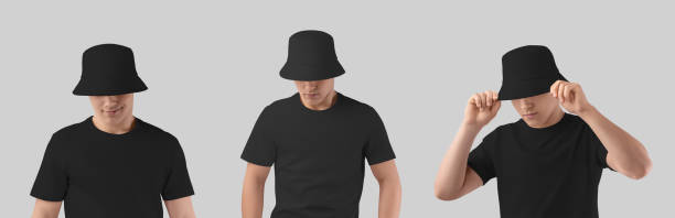istock Mockup of black hat on young smiling guy, blank headgear for design, pattern, branding, commerce. Set 1487694134