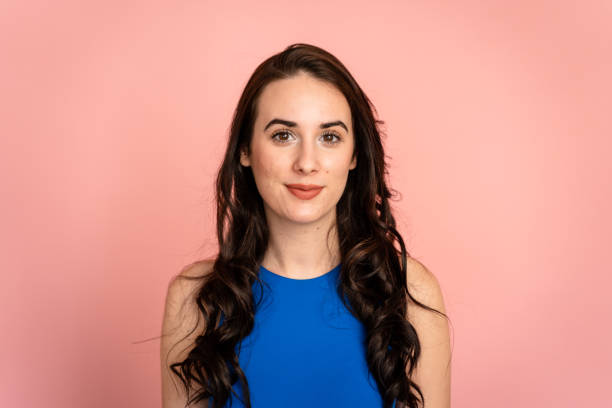 istock Long-haired woman posing in a studio shot. 1487694410