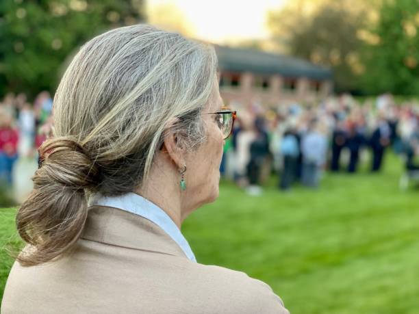 istock Woman watching the Ceremony Lest we Forget 1487696567