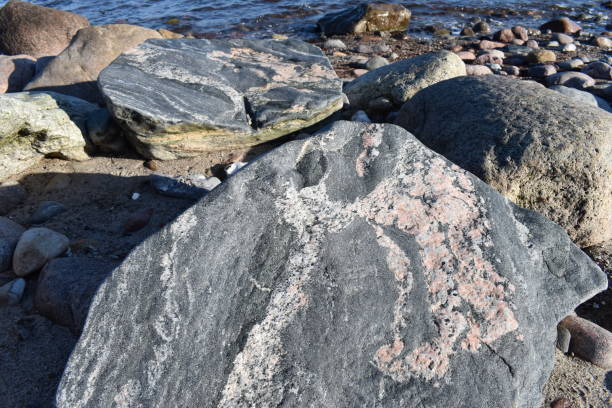 istock A stone divided in two by the water and frost. 1487700164
