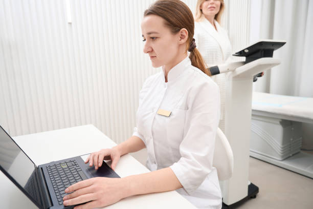 istock Young doctor conducts a bioimpedancemetry diagnostic procedure 1487700566