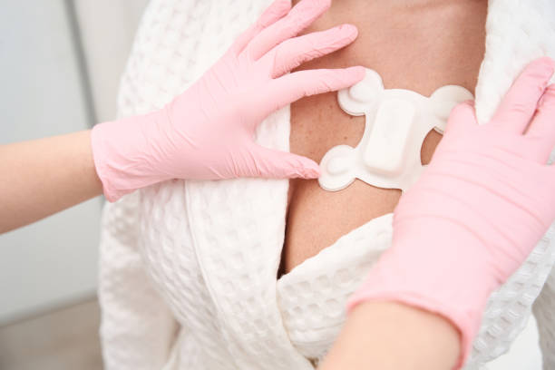 istock Diagnostician attaches a special sensor for Holter examination 1487700766