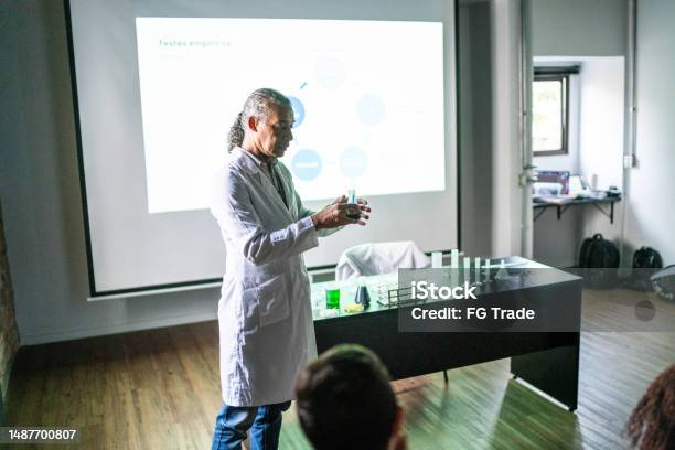 Teacher Doing A Presentation During Chemistry Class Stock Photo - Download Image Now