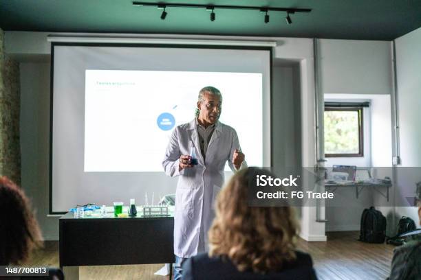 Teacher Doing A Presentation During Chemistry Class Stock Photo - Download Image Now