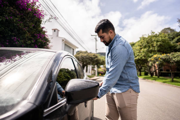 istock Young man opening door on his car 1487703719