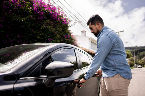 istock Young man opening door on his car 1487703733