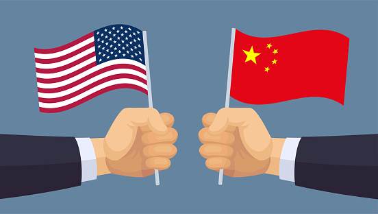 Chinese and American Flags. Political and economic confrontation between China and the United States.