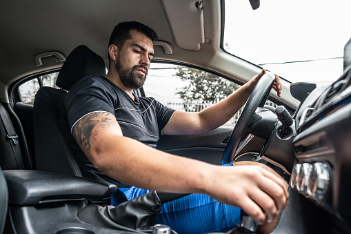 Young man driving in a car