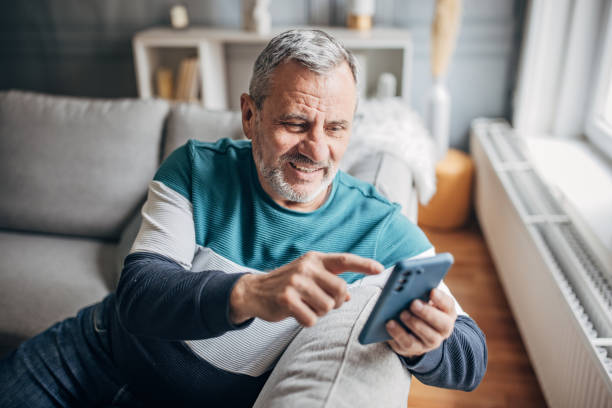 istock An elderly man uses a mobile phone to chat online 1487705497