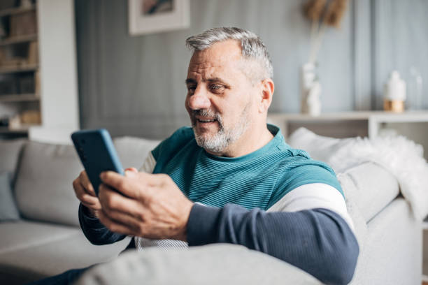 istock An elderly man uses a mobile phone to chat online 1487705564