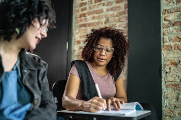 istock Friends talking in the classroom 1487705978