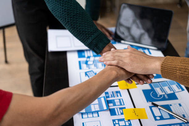 istock Handshake brainstorming ideas about the app. Planning a creative website design and development templates for collaborative mobile projects in the office. 1487707662