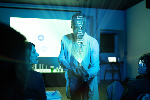 Teacher showing a holographic DNA image in the classroom