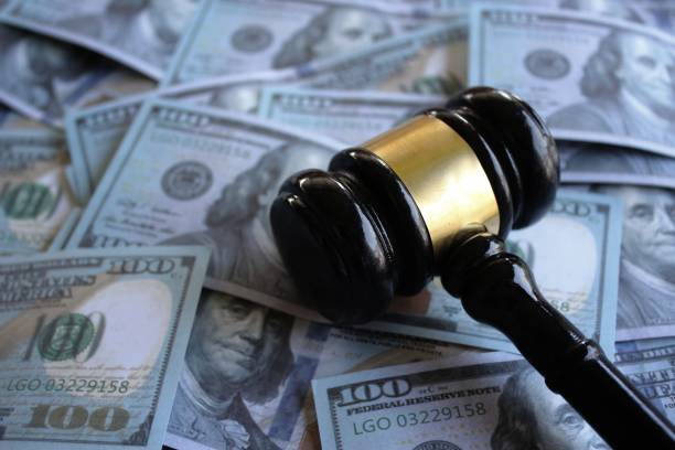 istock Judge gavel and money. 1487712131