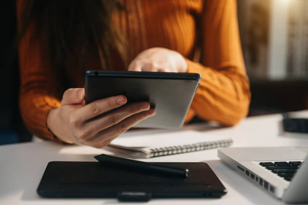 istock business documents on office table with smart phone and digital tablet and graph financial 1487713431
