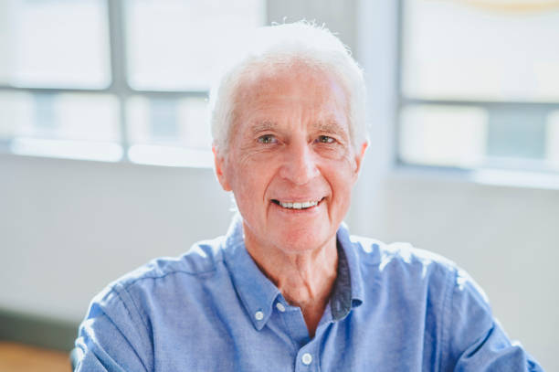 istock Close-up of senior man smiling at camera 1487718090