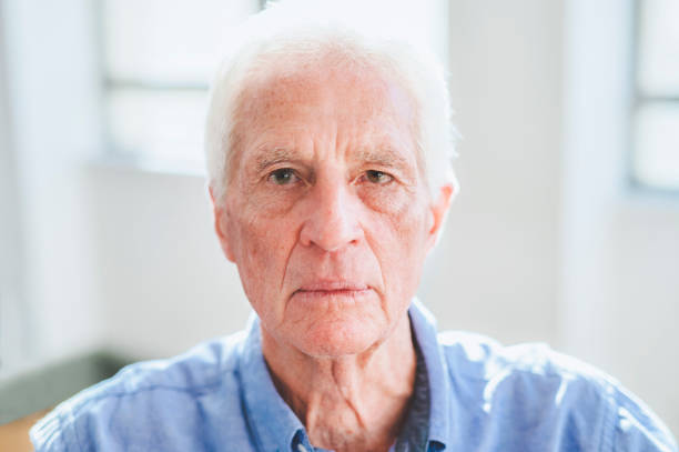 istock Extreme close-up of senior man with blank expression 1487718114