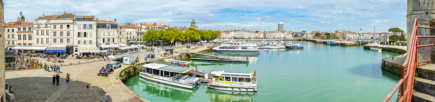 Quays of the Old Port of La Rochelle seen from the Rue sur les Murs walkway at the entrance of the Chain Tower